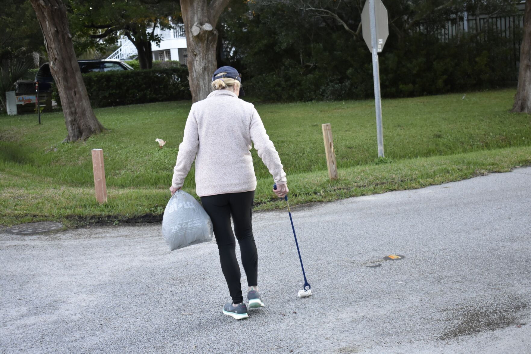 Person picking up trash 2
